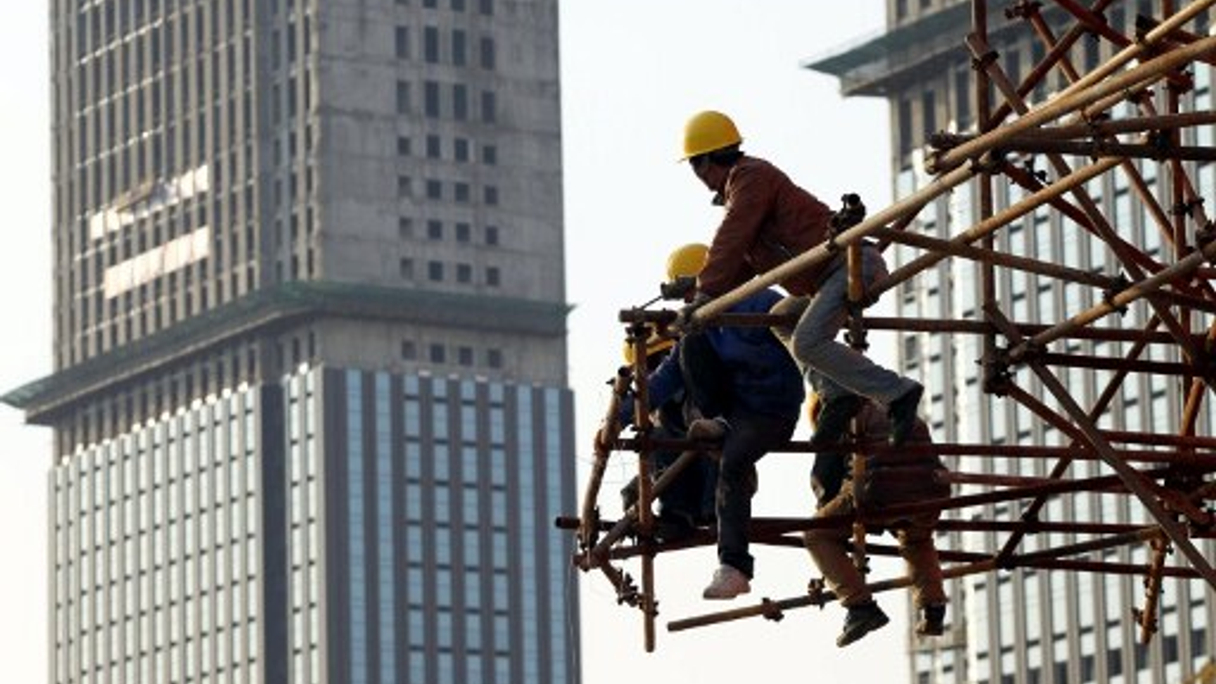 <div style="text-align: left;">
Construction of commercial buildings in China’s Nantong city (Imaginechina)</div>
