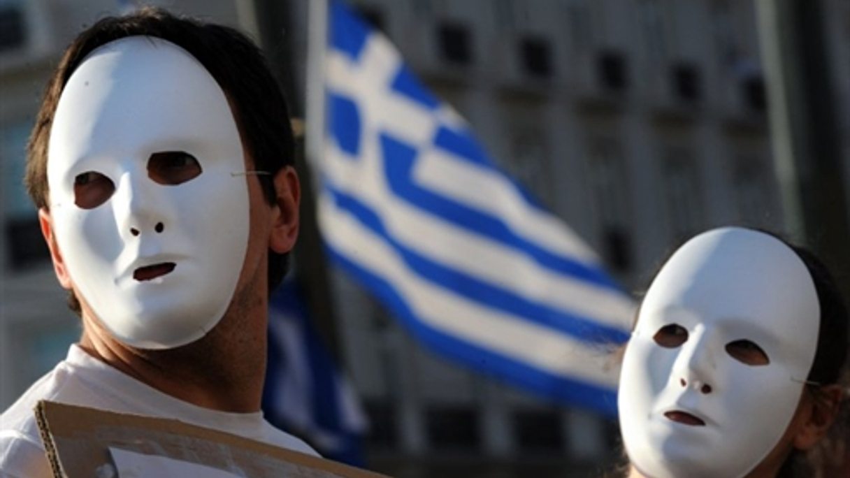 Protesters wearing traditional Greek Tragedy masks voice their anger over austerity measures attached to an EU/IMF bailout package last week.