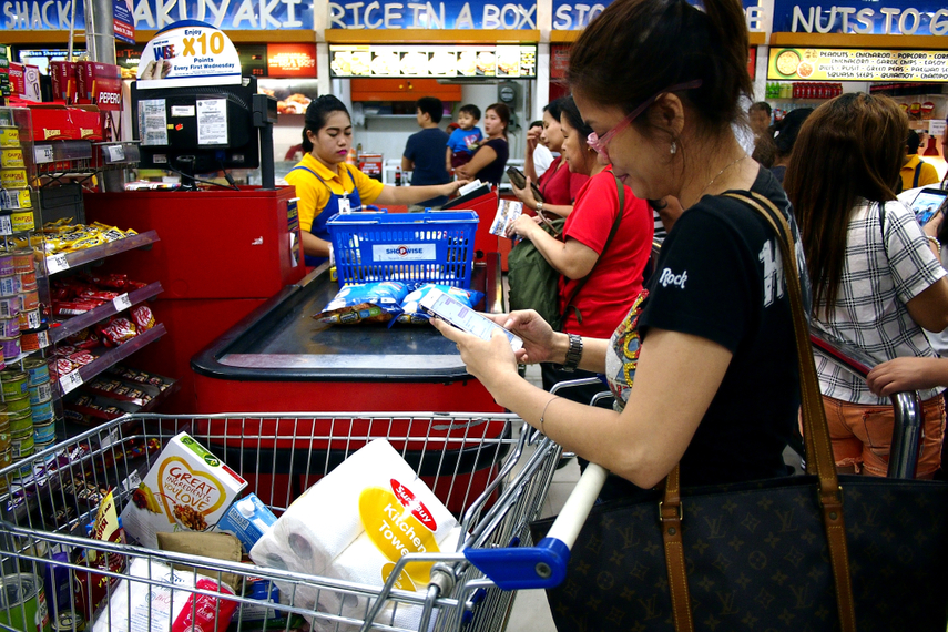 Shoppers buy groceries in Antipolo City, Philippines on March 15, 2018.  