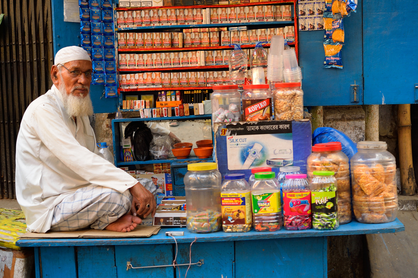 A man sells a variety of products from his kirana store in Kolkata