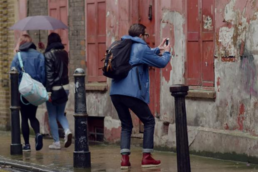 Apple defies critics with record iPhone sales