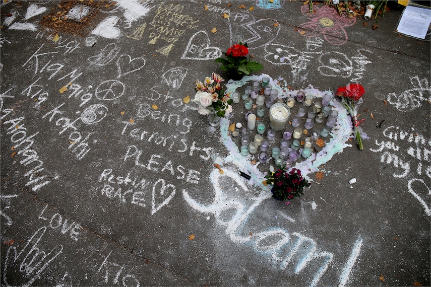 Messages written in chalk are seen on a pavement in Christchurch after 50 worshippers were killed last week in two mosque attacks. (Photo: David Moir/AFP)