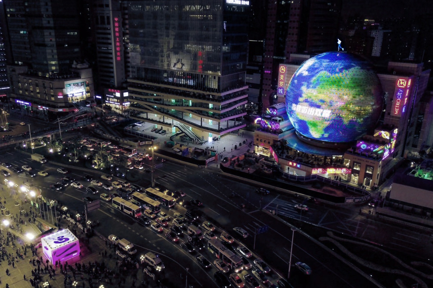 'Choose go' turned a 50-metre hemisphere building at Shanghai’s Metro-City mall into a globe spinning at the speed of a person apparently running on top.