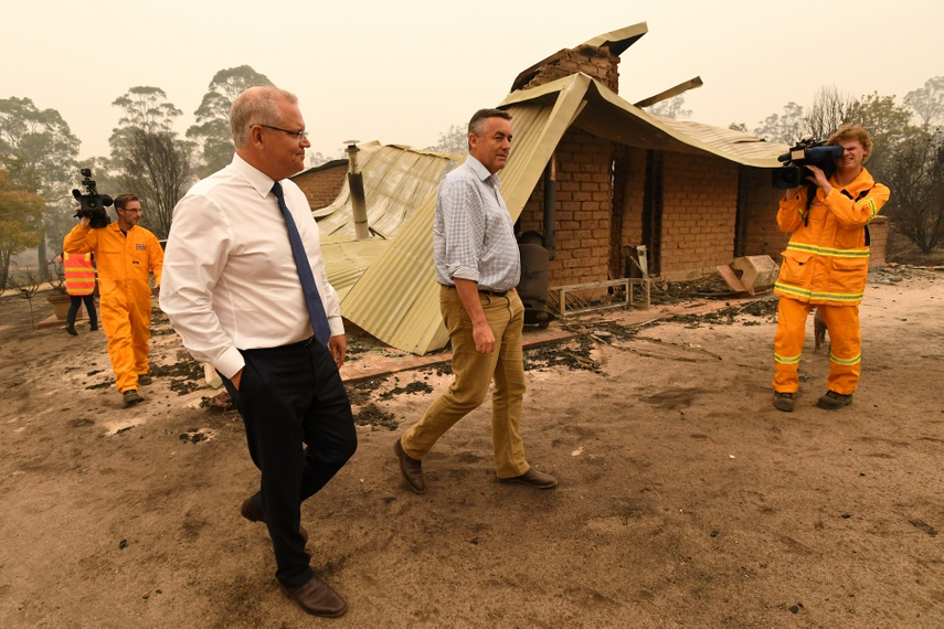 Scott Morrison (left) visits Sarsfield, Victoria, an area hit by bushfires