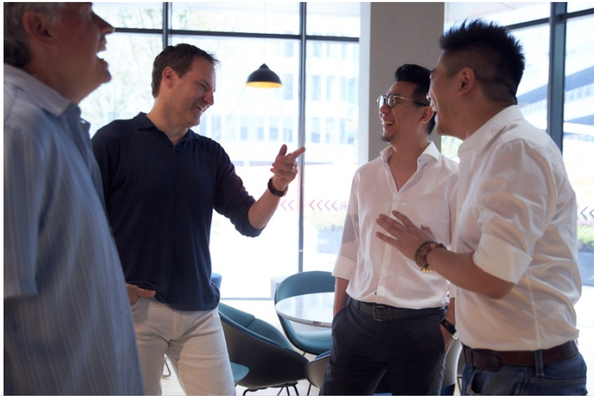 Jon Cook is in a good mood these days, seen here having some laughs with staff in Shanghai